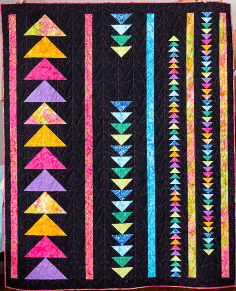 Up and Down- modern flying geese quilt pattern in batiks with black backgoround