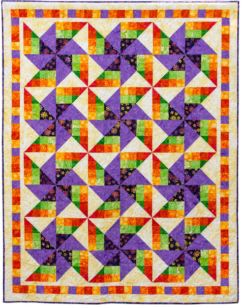 Colorful quilt with geometric pattern on a white background