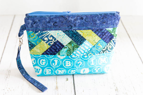 The medium Pack it Up! bag in Just My Type is a fun zippered pouch perfect for storing all those essentials.