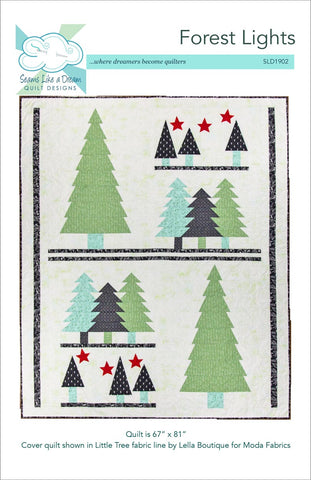 Forest lights- a modern holiday tree quilt in green, aqua and black fabrics.