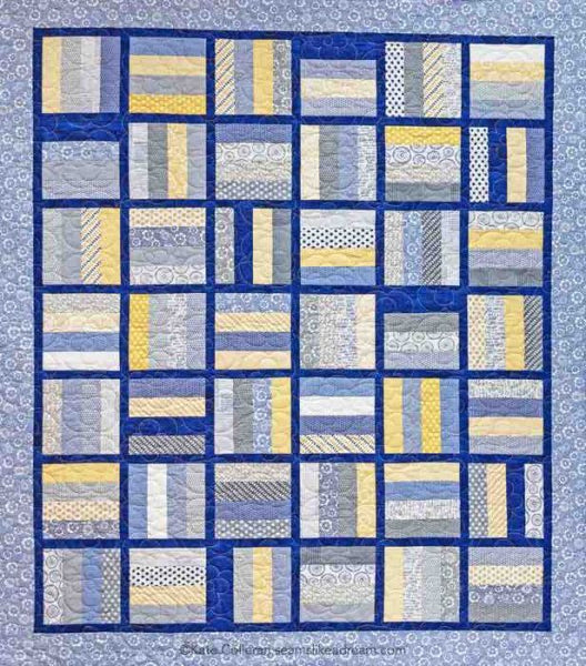 Hop the Fence- a strip quilt shown in blue and yellow