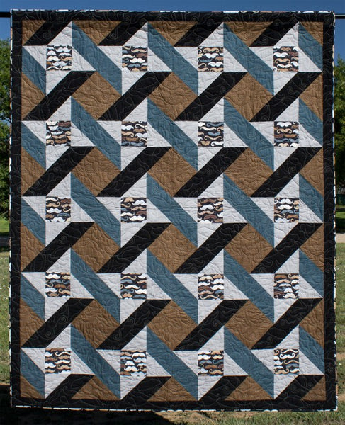 Urban Twist lap quilt in brown, black and blue fabrics with mustache fabric 
