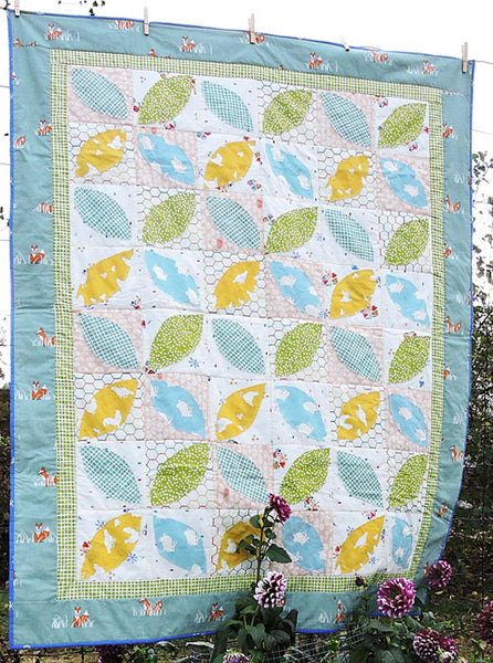 Little Leaves- a fun pieced and machine appliquéd baby quilt pattern in organic fabrics