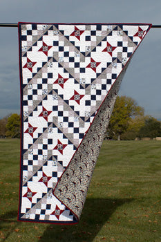 Sgt Stanley- a pieced star quilt in red, white and blue