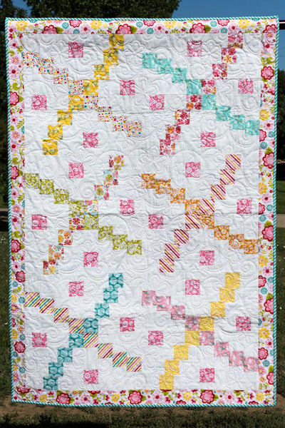 Whirlybird- scrappy baby quilt version in pinks