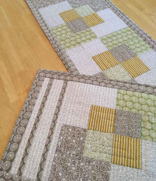 Stroll - a quilted placemat and table runner pattern in tan and gold fabrics from Urban Scandinavian fabric line by Kirstyn Cogan